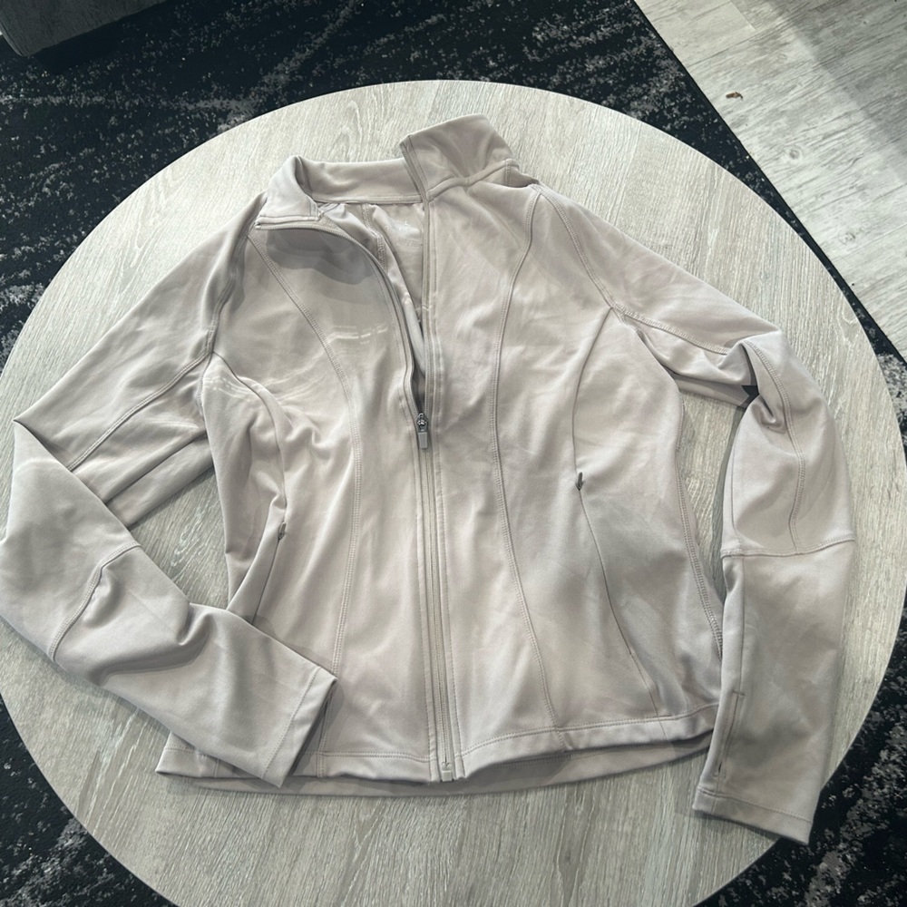 Danskin size small zip up with pockets and thumb holes